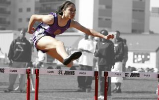 Woman running hurdles